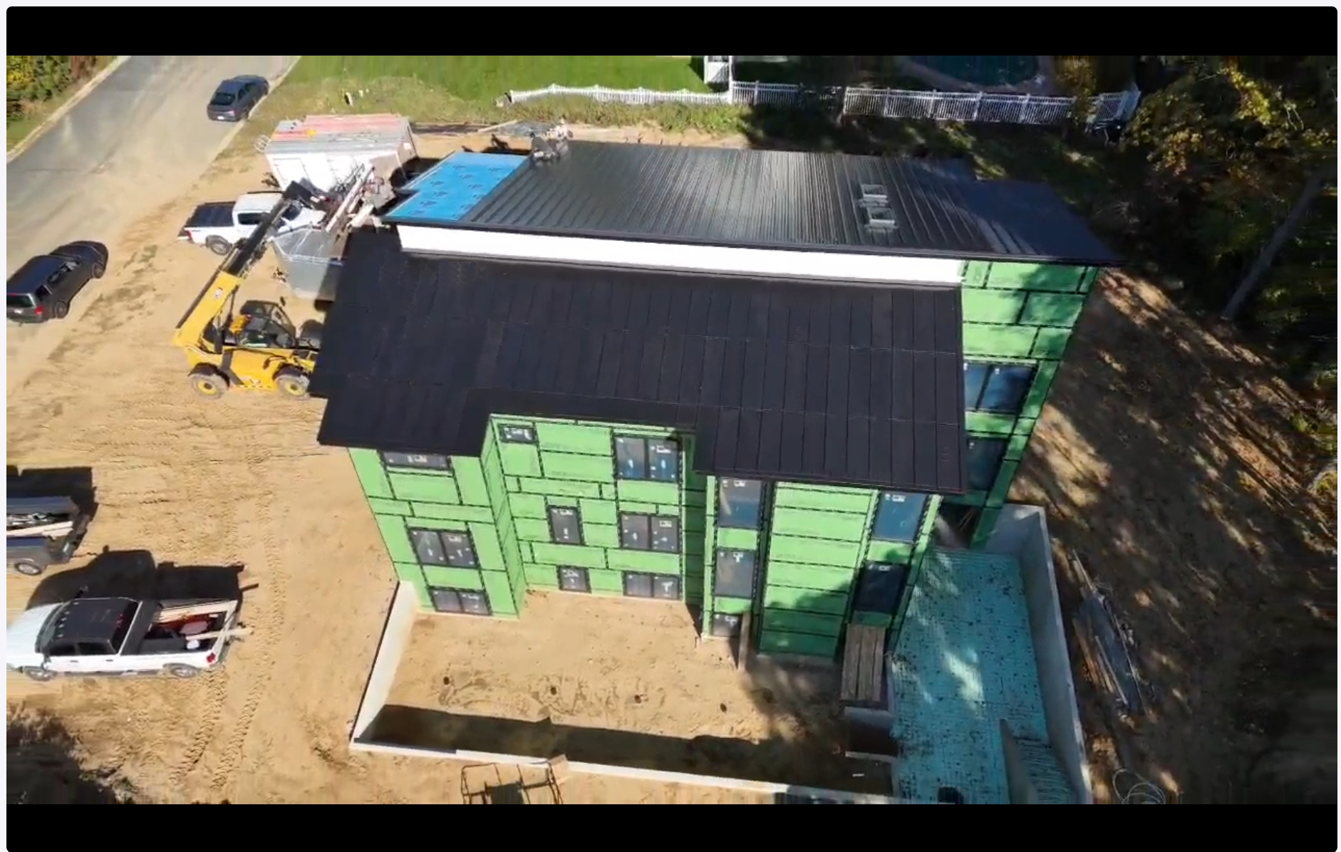 Drone view of an integrated solar roof install underway in Kalamazoo, Michigan