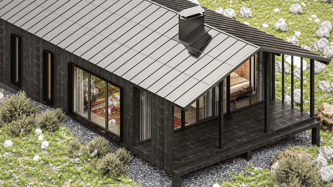 Black cabin with a Roofit.Solar integrated solar metal roof