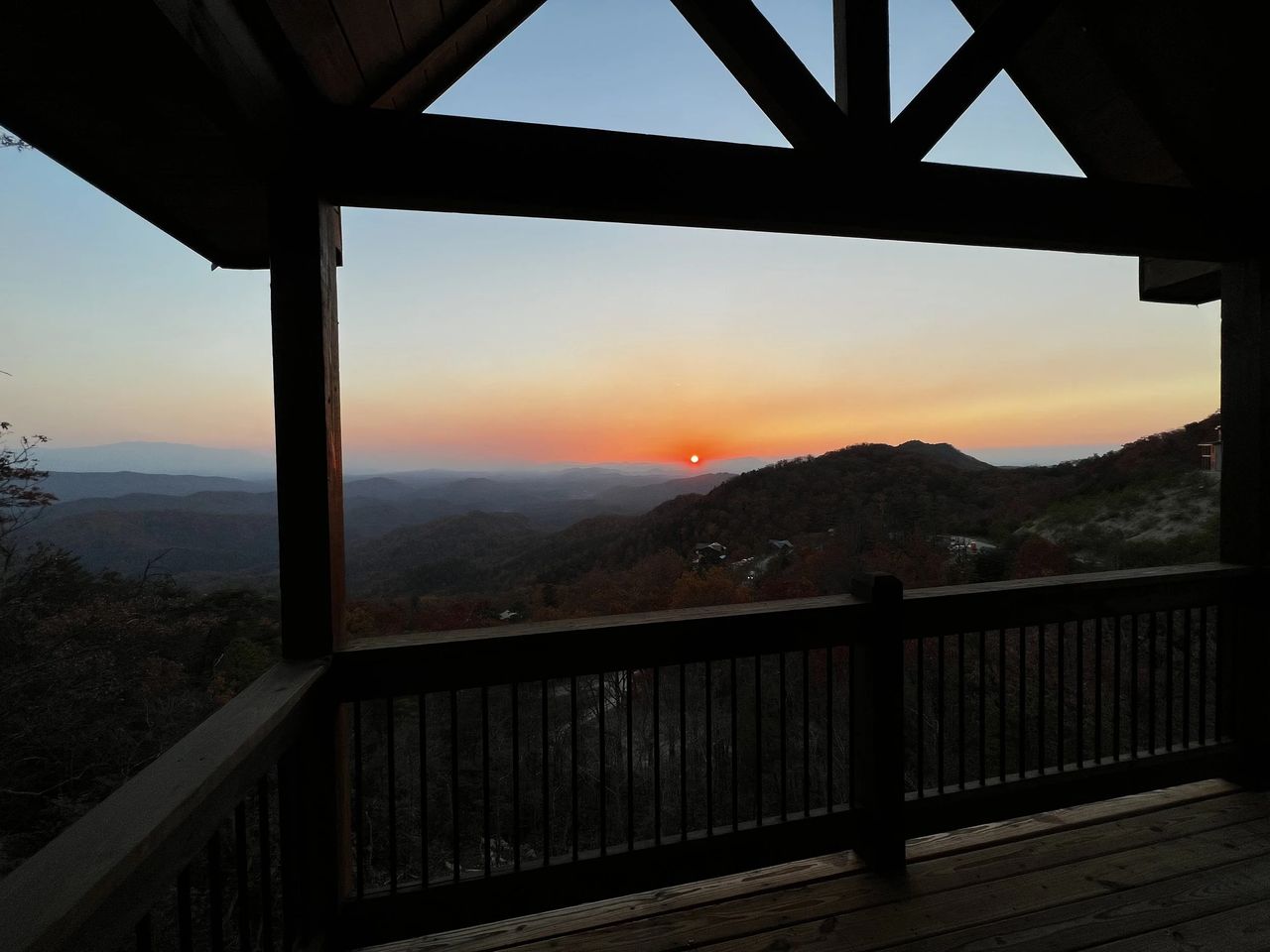 Sunset from a mountain cabin porch in the Smoky Mountains