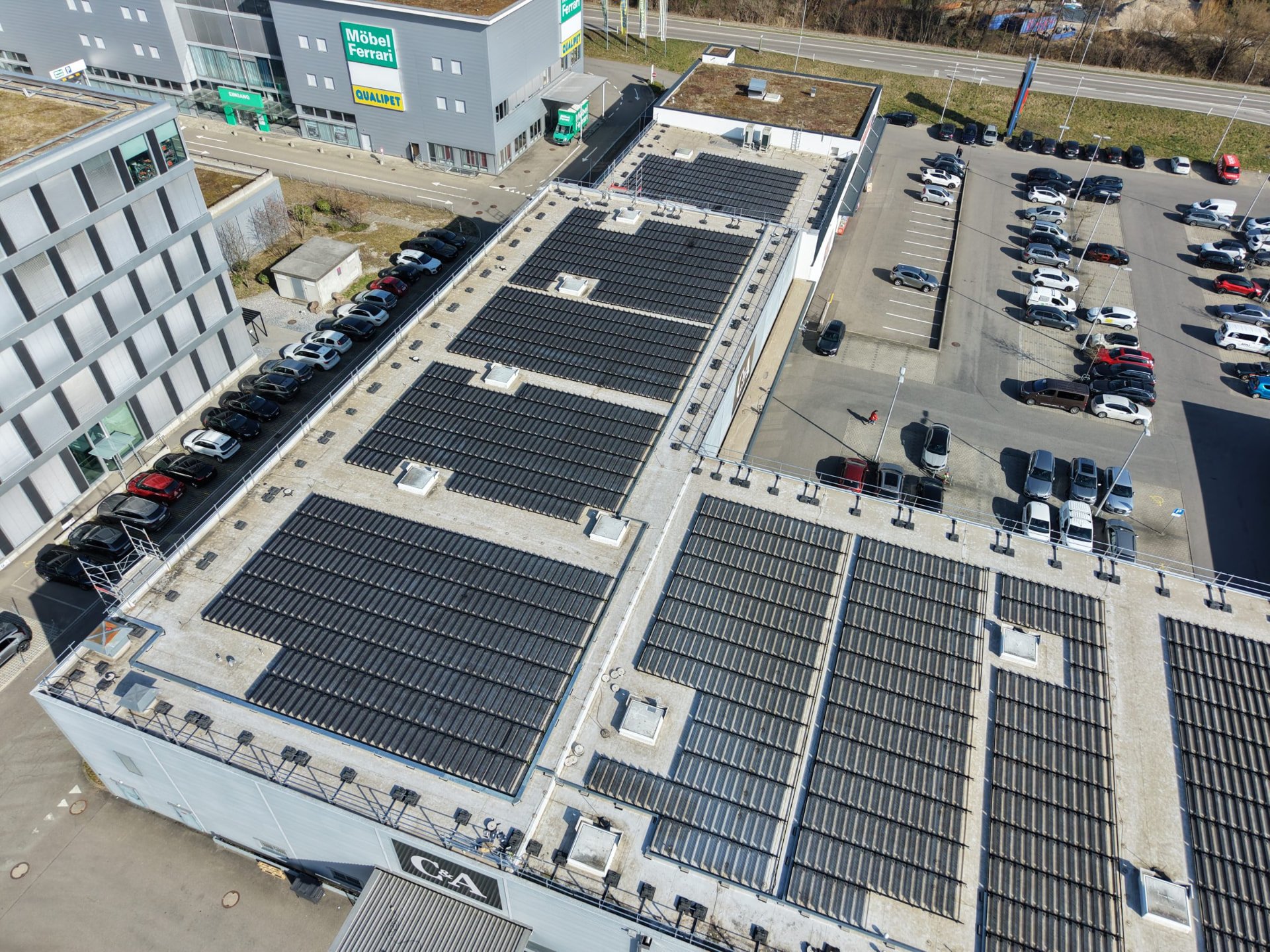 Over Easy Solar rows on a commercial roof in Switzerland